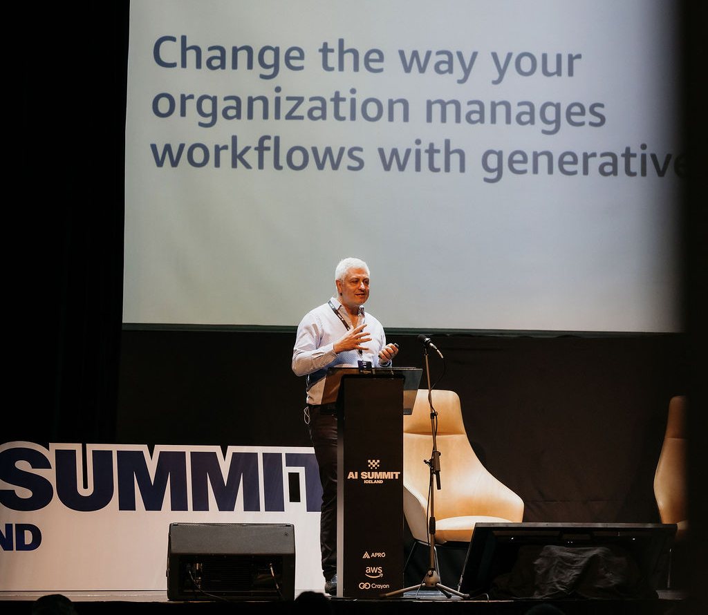 Faris Haddad speaking on stage at AI Summit Iceland